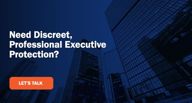 Dark blue image of tall city office buildings with bold white text reading, “Need Discreet, Professional Executive Protection?” An orange call-to-action button beneath the text says, “Let's talk."